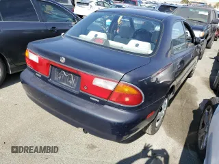 1997 Mazda Protege DX z VIN JM1BC1412V0157268, wystawiony jako Copart lot #61380564 z przebiegiem 85 356 mil mil oraz Szkoda całkowita • Salvage title. Historia ofert i sprzedaży dostępna na DreamBid. Obrazek 3.