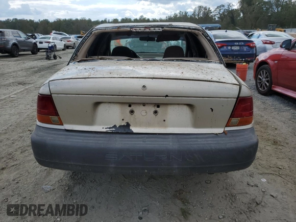 1999 Saturn SL z VIN 1G8ZH5280XZ178863, wystawiony jako Copart lot #73660474 z przebiegiem 195 738 mil mil oraz Szkody całkowita. Historia ofert i sprzedaży dostępna na DreamBid. Obrazek 6.