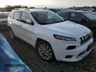 2016 Jeep Cherokee Overland with VIN 1C4PJLJB0GW302604, listed as a Copart auction lot 70624834 with 96,394 mi miles and Salvage title. Bid and sale history available at DreamBid. Image 4.