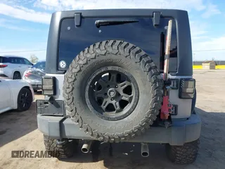 2014 Jeep Wrangler Sport with VIN 1C4AJWAG5EL206565, listed as a IAAI auction lot 42015000 with 90,129 mi miles and . Bid and sale history available at carsss.com. Image 16.