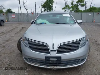 2013 Lincoln MKS with VIN 1LNHL9DK4DG606551, listed as a IAAI auction lot 42343140 with 70,424 mi miles and . Bid and sale history available at DreamBid. Image 12.