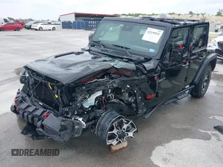 2021 Jeep Wrangler Unlimited Rubicon with VIN 1C4HJXFG7MW662092, listed as a IAAI auction lot 42139521 with 32,055 mi miles and . Bid and sale history available at carsss.com. Image 2.