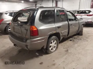 2005 GMC Envoy SLT with VIN 1GKDT13S352257892, listed as a IAAI auction lot 41690880 with 134,216 mi miles. Bid and sale history available at carsss.com. Image 4.