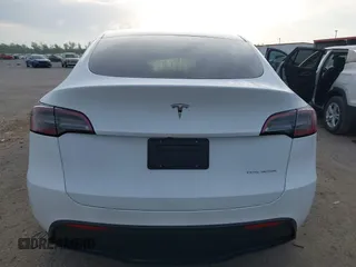2023 Tesla Model Y Long Range with VIN 7SAYGDEE4PF770307, listed as a IAAI auction lot 42141175 with 34,901 mi miles and . Bid and sale history available at carsss.com. Image 17.