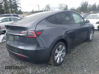 2023 Tesla Model Y Long Range with VIN 7SAYGAEE4PF871281, listed as a IAAI auction lot 41989805 with 15,501 mi miles. Bid and sale history available at carsss.com. Image 4.