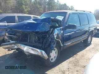 1999 GMC Yukon with VIN 1GKEK13R2XJ708582, listed as a IAAI auction lot 41698586 with 252,630 mi miles. Bid and sale history available at carsss.com. Image 2.