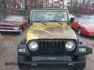 2000 Jeep Wrangler Sport with VIN 1J4FA49S4YP763414, listed as a IAAI auction lot 41478005 with 222,012 mi miles. Bid and sale history available at carsss.com. Image 6.