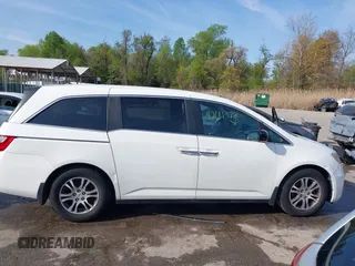 2011 Honda Odyssey EX-L with VIN 5FNRL5H6XBB059162, listed as a IAAI auction lot 42061378 with 164,317 mi miles and . Bid and sale history available at carsss.com. Image 13.