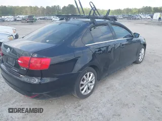 2013 Volkswagen Jetta SE with VIN 3VWDX7AJ9DM308054, listed as a IAAI auction lot 41726950 with 219,711 mi miles and . Bid and sale history available at DreamBid. Image 4.