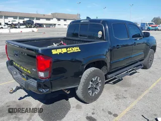 2018 Toyota Tacoma SR with VIN 3TMCZ5AN2JM127244, listed as a IAAI auction lot 41698199 with 61,535 mi miles and . Bid and sale history available at DreamBid. Image 4.