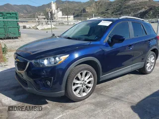 2014 Mazda CX-5 Grand Touring with VIN JM3KE2DY7E0376389, listed as a IAAI auction lot 42014946 with 126,081 mi miles. Bid and sale history available at carsss.com. Image 2.