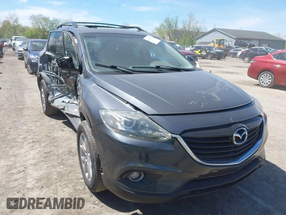 2015 Mazda CX-9 Touring z VIN JM3TB3CV3F0465162, wystawiony jako IAAI lot #42112814 z przebiegiem 108 623 mil mil oraz . Historia ofert i sprzedaży dostępna na DreamBid. Obrazek 1.