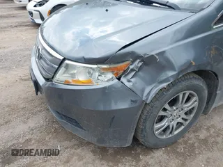 2012 Honda Odyssey EX z VIN 5FNRL5H45CB084342, wystawiony jako IAAI lot #42329303 z przebiegiem 173 711 mil mil oraz . Historia ofert i sprzedaży dostępna na DreamBid. Obrazek 6.