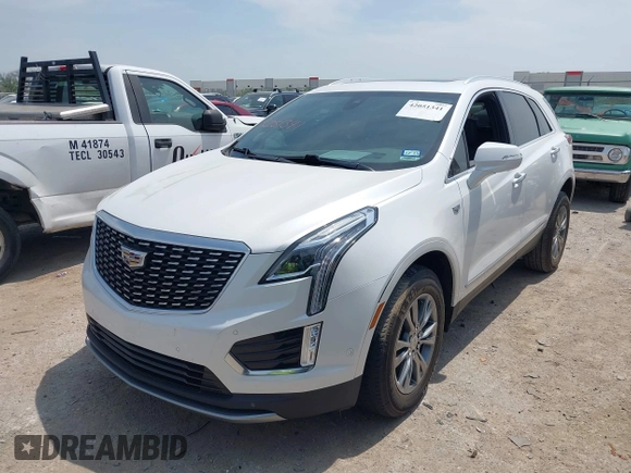 2021 Cadillac XT5 FWD Premium Luxury z VIN 1GYKNCR42MZ174309, wystawiony jako IAAI lot #42051341 z przebiegiem 75 544 mil mil oraz . Historia ofert i sprzedaży dostępna na DreamBid. Obrazek 2.