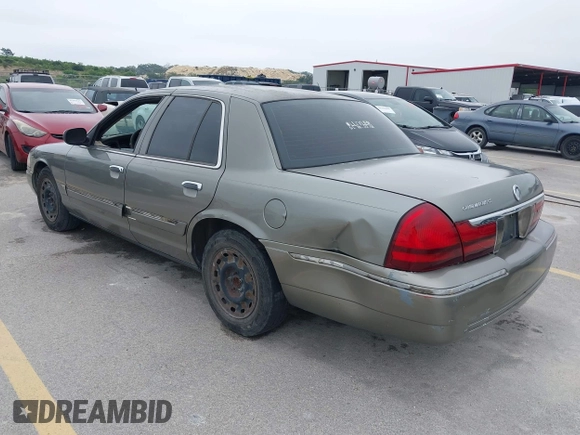 2003 Mercury Grand Marquis GS Convenience z VIN 2MEFM74W83X678151, wystawiony jako IAAI lot #42393410 z przebiegiem 273 966 mil mil oraz . Historia ofert i sprzedaży dostępna na DreamBid. Obrazek 3.