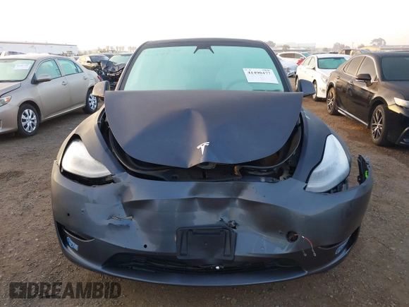 2021 Tesla Model Y Standard Range z VIN 5YJYGDED4MF121963, wystawiony jako IAAI lot #41490477 z przebiegiem 41 941 mil mil oraz . Historia ofert i sprzedaży dostępna na DreamBid. Obrazek 6.