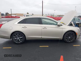 2013 Cadillac XTS z VIN 2G61N5S32D9127146, wystawiony jako IAAI lot #41578528 z przebiegiem 98 529 mil mil oraz . Historia ofert i sprzedaży dostępna na DreamBid. Obrazek 13.