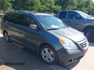 2010 Honda Odyssey Touring with VIN 5FNRL3H90AB057238, listed as a IAAI auction lot 42496055 with 183,465 mi miles and . Bid and sale history available at DreamBid. Image 1.