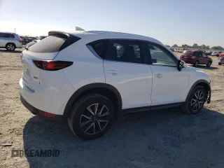 2018 Mazda CX-5 Touring z VIN JM3KFACM7J0370737, wystawiony jako Copart lot #60113725 z przebiegiem 131 385 mil mil oraz Szkoda całkowita • Salvage title. Historia ofert i sprzedaży dostępna na DreamBid. Obrazek 3.