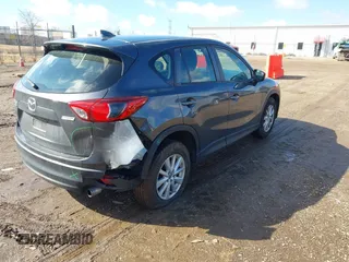 2016 Mazda CX-5 Sport with VIN JM3KE4BY5G0829927, listed as a IAAI auction lot 41678552 with 121,476 mi miles. Bid and sale history available at carsss.com. Image 4.