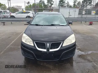2009 Pontiac G6 1SB with VIN 1G2ZJ57B594263412, listed as a IAAI auction lot 41844953 with 234,057 mi miles and . Bid and sale history available at DreamBid. Image 12.
