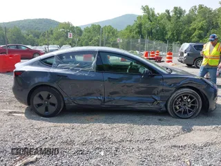 2023 Tesla Model 3 with VIN 5YJ3E1EA2PF566047, listed as a IAAI auction lot 42481008 with 21,143 mi miles and . Bid and sale history available at DreamBid. Image 13.