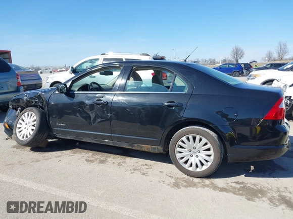 2010 Ford Fusion Hybrid z VIN 3FADP0L39AR396746, wystawiony jako IAAI lot #41764282 z przebiegiem 132 582 mil mil oraz . Historia ofert i sprzedaży dostępna na DreamBid. Obrazek 14.