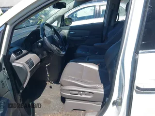 2014 Honda Odyssey Touring with VIN 5FNRL5H94EB071788, listed as a IAAI auction lot 42523959 with 244,734 mi miles and . Bid and sale history available at DreamBid. Image 5.