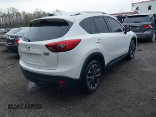 2016 Mazda CX-5 Grand Touring with VIN JM3KE4DY3G0838204, listed as a IAAI auction lot 41961049 with 98,918 mi miles and . Bid and sale history available at carsss.com. Image 4.