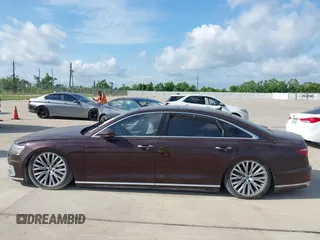 2019 Audi A8 z VIN WAU8DAF85KN004784, wystawiony jako IAAI lot #42414695 z przebiegiem Nie podano mil oraz . Historia ofert i sprzedaży dostępna na DreamBid. Obrazek 13.