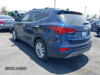 2018 Hyundai Santa Fe 2.0T z VIN 5XYZU4LA8JG537427, wystawiony jako IAAI lot #42349692 z przebiegiem 148 764 mil mil oraz . Historia ofert i sprzedaży dostępna na DreamBid. Obrazek 3.