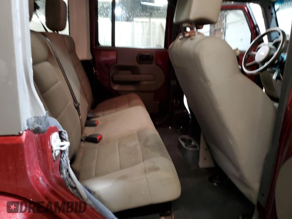 2007 Jeep Wrangler Unlimited Sahara with VIN 1J4GA59197L104784, listed as a Copart auction lot 56700205 with 156,382 mi miles and Salvage title. Bid and sale history available at DreamBid. Image 11.