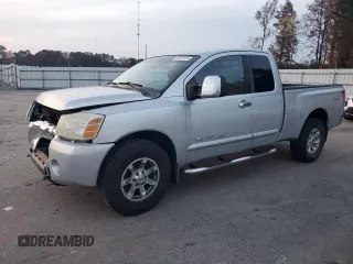 2005 Nissan Titan SE with VIN 1N6BA06B45N539629, listed as a Copart auction lot 82527074 with 154,255 mi miles and Salvage title. Bid and sale history available at DreamBid. Image 1.