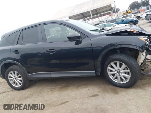 2014 Mazda CX-5 Touring z VIN JM3KE2CY3E0355332, wystawiony jako IAAI lot #42096306 z przebiegiem 108 198 mil mil oraz . Historia ofert i sprzedaży dostępna na DreamBid. Obrazek 12.