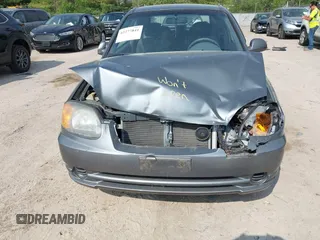 2003 Hyundai Accent GL z VIN KMHCG35CX3U243322, wystawiony jako IAAI lot #42277841 z przebiegiem 45 855 mil mil oraz . Historia ofert i sprzedaży dostępna na DreamBid. Obrazek 6.