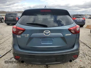 2016 Mazda CX-5 Grand Touring z VIN JM3KE4DY2G0637779, wystawiony jako Copart lot #52001805 z przebiegiem 184 381 mil mil oraz Czysty tytuł • Clean title. Historia ofert i sprzedaży dostępna na DreamBid. Obrazek 6.