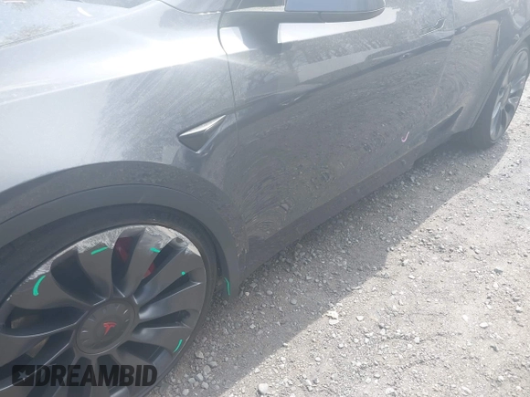2022 Tesla Model Y Performance with VIN 7SAYGDEF3NF324705, listed as a IAAI auction lot 42076565 with 66,573 mi miles and . Bid and sale history available at DreamBid. Image 6.