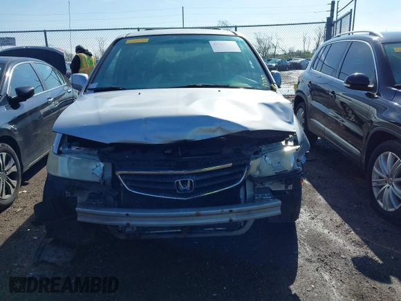 2004 Honda Odyssey EX with VIN 5FNRL18664B051006, listed as a IAAI auction lot 41967247 with 275,047 mi miles and . Bid and sale history available at DreamBid. Image 13.
