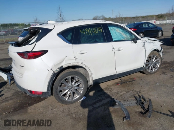 2020 Mazda CX-5 Grand Touring with VIN JM3KFBDM6L0751471, listed as a IAAI auction lot 41914849 with Not Provided miles and . Bid and sale history available at carsss.com. Image 4.