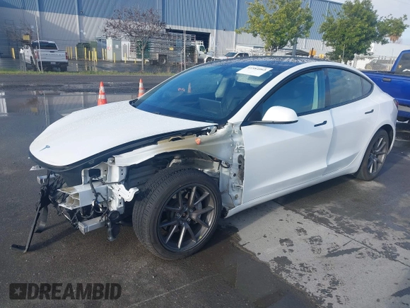 2021 Tesla Model 3 Long Range with VIN 5YJ3E1EB9MF055990, listed as a IAAI auction lot 41584065 with 49,147 mi miles and . Bid and sale history available at carsss.com. Image 2.