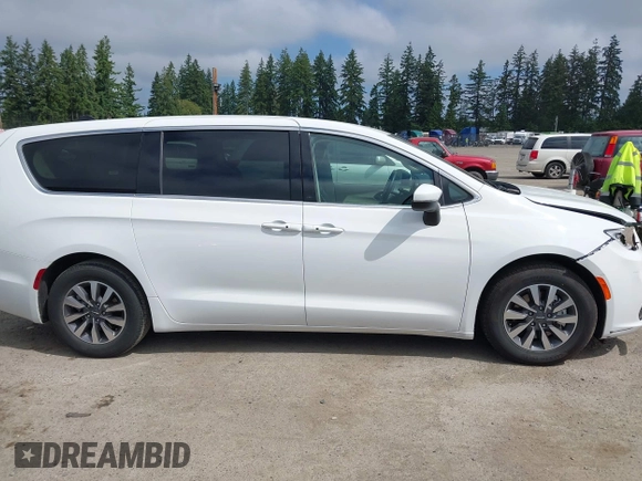 2023 Chrysler Pacifica Hybrid Touring L with VIN 2C4RC1L77PR541513, listed as a IAAI auction lot 42433421 with 53,979 mi miles and . Bid and sale history available at DreamBid. Image 14.