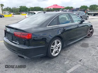2016 Audi A6 2.0T Premium Plus with VIN WAUGFAFC6GN055826, listed as a IAAI auction lot 42011778 with 98,210 mi miles. Bid and sale history available at carsss.com. Image 4.