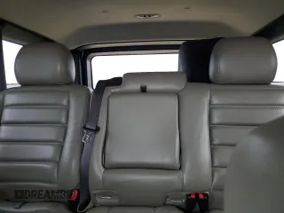 2005 Hummer H2 SUV with VIN 5GRGN23UX5H116341, listed as a Copart auction lot 76877704 with 145,778 mi miles and Salvage Title. Bid and sale history available at carsss.com. Image 10.