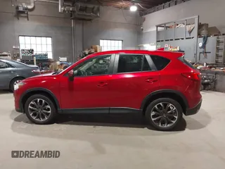 2016 Mazda CX-5 Grand Touring with VIN JM3KE4DY6G0690923, listed as a IAAI auction lot 41875553 with 179,489 mi miles. Bid and sale history available at carsss.com. Image 14.
