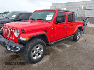 2020 Jeep Gladiator Overland with VIN 1C6HJTFG2LL136758, listed as a IAAI auction lot 42414592 with 57,279 mi miles and . Bid and sale history available at DreamBid. Image 2.