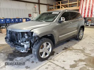 2013 Jeep Grand Cherokee Overland with VIN 1C4RJFCT5DC599866, listed as a Copart auction lot 51837395 with 105,521 mi miles and Salvage Title. Bid and sale history available at carsss.com. Image 1.