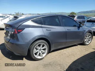 2022 Tesla Model Y Long Range with VIN 7SAYGDEE2NF402320, listed as a Copart auction lot 50396605 with 27,426 mi miles and Salvage Title. Bid and sale history available at DreamBid. Image 3.