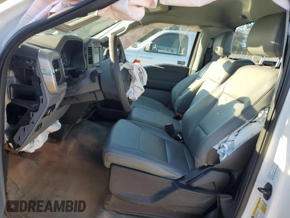 2023 Ford F-150 XL with VIN 1FTMF1CB2PKG05574, listed as a Copart auction lot 49050295 with 33,563 mi miles and Salvage Title. Bid and sale history available at carsss.com. Image 7.