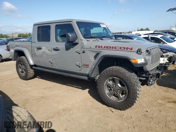 2023 Jeep Gladiator Rubicon with VIN 1C6JJTBG8PL550219, listed as a Copart auction lot 54627685 with 9,671 mi miles and Salvage title. Bid and sale history available at DreamBid. Image 4.