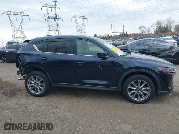 2021 Mazda CX-5 Grand Touring with VIN JM3KFADM0M1321375, listed as a IAAI auction lot 41913449 with 88,178 mi miles. Bid and sale history available at carsss.com. Image 14.